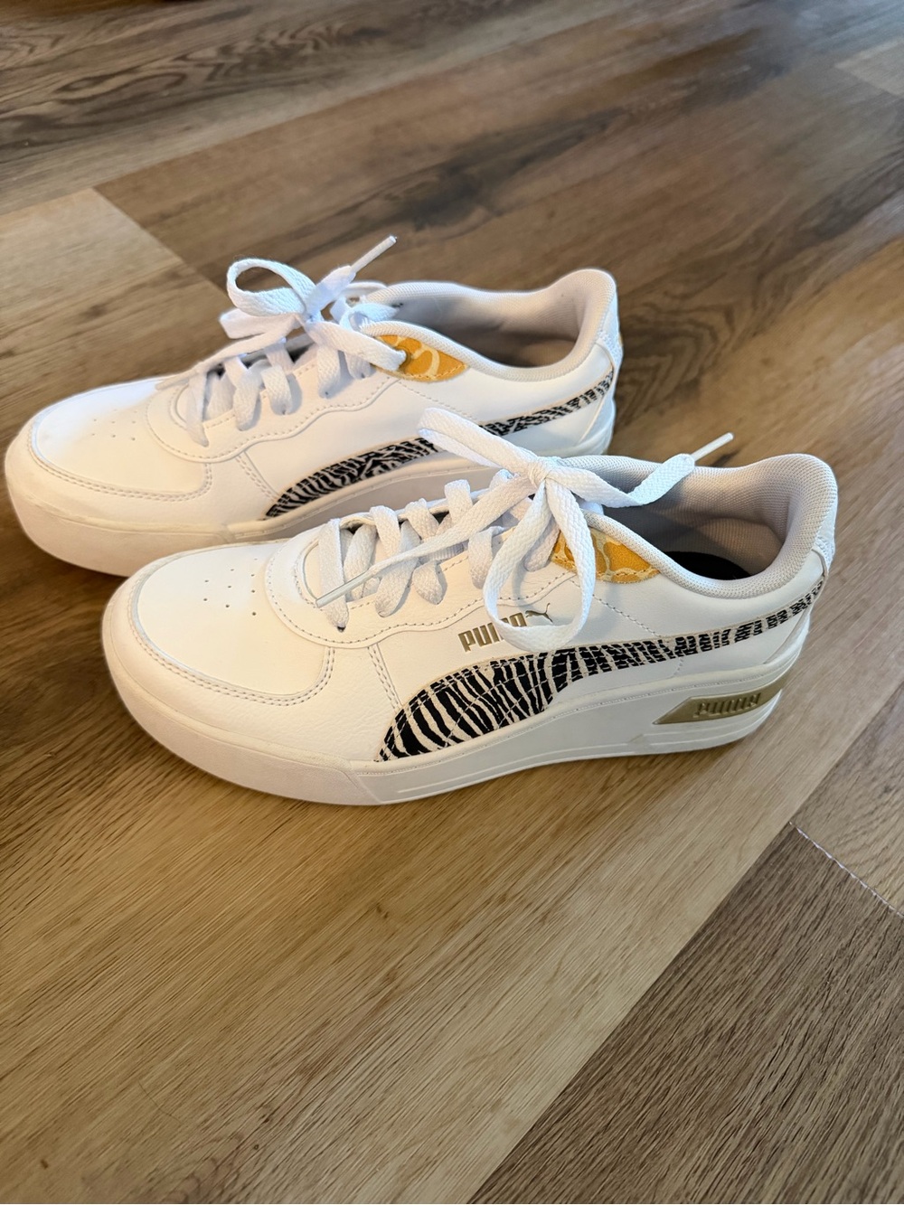 Puma White Sneakers with Black Zebra Stripe and Gold Accents